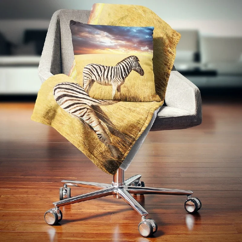 Fleece blankets for a cozy and plush textureFleece blankets for a cozy and plush textureDesignart 'Solitary Zebra in African Grassland' African Throw Blanket